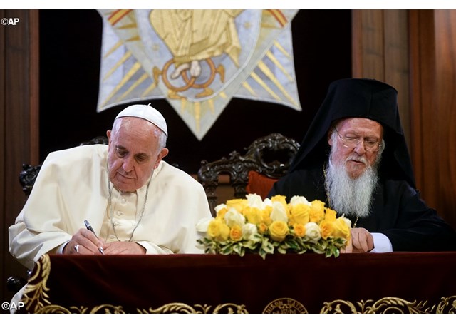 Pope Francis and the Ecumenical Patriarch, Bartholomew I, sign the Joint Declaration - AP